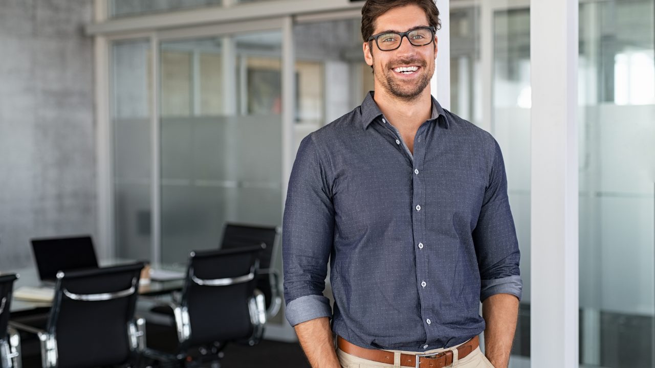 Success businessman smiling in office